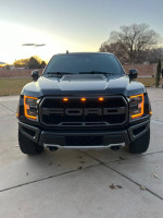 2019 Ford Raptor with carbon fiber package, fully loaded, parked outdoors at sunset.