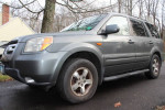 2007 Honda Pilot EX-L 2WD SUV with 63,000 miles, equipped with leather interior and power features.