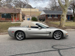 2001 Chevrolet Corvette C5 Convertible in Pewter Metallic parked on street with snowy mountains backdrop