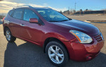 2011 Nissan Rogue SL AWD in maroon color with new winter tires parked outdoors