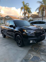 2017 Honda Ridgeline Black Edition AWD in pristine condition with new tires and red leather seats.