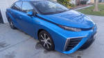 2017 Toyota Mirai hydrogen-powered EV in blue color, featuring sleek design and advanced technology.