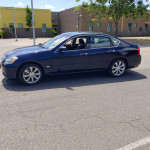 2007 Infiniti M35 RWD in dark blue parked with low mileage, showcasing sleek design and premium features.