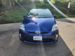 Front view of a blue 2011 Toyota Prius One with 102,000 miles parked outdoors