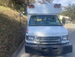 Front view of a 1997 Ford E-350 van with low mileage and recent repairs, ideal for bus conversions.