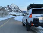2010 Lexus GX 460 4WD parked on a snowy road with mountains in the background