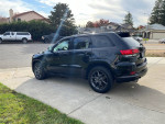 2020 Jeep Cherokee Limited FWD parked, showcasing its sleek design and stylish black exterior.
