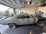 1969 Chevrolet Camaro project car in garage, includes partially built engine and rebuilt transmission.