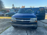 Front view of a 2002 Chevrolet Tahoe with 134,000 miles, parked outdoors with open door