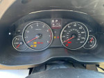 Dashboard of a 2013 Subaru Outback showing mileage of 102,731 and warning lights.
