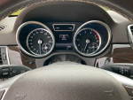 Interior view of a 2015 Mercedes ML350 with speedometer and dashboard controls