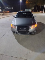 Front view of a 2007 Audi A4 Quattro parked at night with glowing headlights
