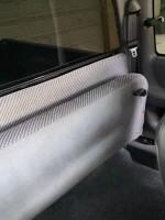 Interior view of a 1999 Dodge Ram 1500 showing the cab's seating and window details.