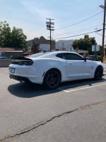 2021 Chevrolet Camaro SS 1LE in immaculate condition, parked on the street with scenic backdrop.