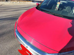 Front view of a 2016 Honda Civic EX in Rallye Red, showcasing its sleek design and sporty look.