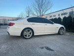 2011 BMW 535xi M-sport Sedan in Alpine white with Dakota black leather interior, parked outdoors
