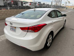 2014 Hyundai Elantra GLS in white, one owner, low mileage, clean Carfax, ready for sale.