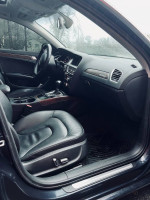 Interior view of 2013 Audi A4 2.0T Premium with leather seats and modern dashboard design