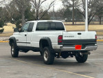 2002 Dodge Ram 2500 Cummins diesel truck in white, clean CO title, long bed and quad cab, ready for sale.