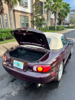2000 Mazda Miata Special Edition with a convertible top and clean exterior, parked in a residential area.