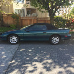 1995 Chevrolet Camaro Z28 convertible in mystic teal with leather interior and new tires parked on the street