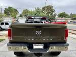 2014 Ram 3500 Longhorn pickup truck with custom rear bumper and enhanced features in driveway