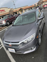 Front view of a 2016 Honda Civic EX sedan in a parking lot with clean exterior.