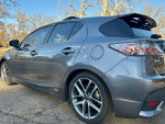 2015 Lexus CT 200h in gray, showcasing its sleek design and alloy wheels on a sunny day.