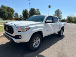 2022 Toyota Tacoma SR5 4WD in excellent condition, with alloy wheels and new tires, parked outdoors