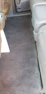 Interior view of the 2012 Honda Odyssey Touring van showcasing the seating and carpet area