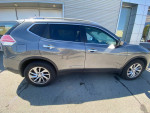 Side view of a 2014 Nissan Rogue SL FWD with low mileage and premium features parked outdoors.
