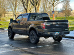 2014 Ford F150 FX4 Supercrew Cab Ecoboost parked in a snowy area, showcasing its sleek design and features.