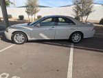 2004 Lincoln LS sedan in silver color parked, featuring low mileage and clean condition.