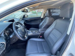 Interior view of a 2020 Lexus NX 300 showing black leather seats and modern dashboard features.