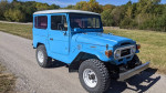 1977 Toyota Landcruiser BJ40 with upgraded disc brakes and power steering, showcasing vintage off-road style.