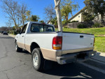 1996 Ford Ranger truck with 59,000 miles parked on a street, featuring a single cab and manual transmission.