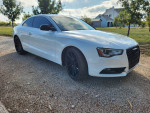 2013 Audi A5 quattro in white with black wheels parked on gravel, showcasing sleek design and modern features.