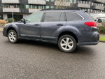 2013 Subaru Outback Wagon AWD with heated seats parked in a street, showcasing its reliable design and clean exterior.