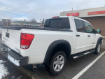 2013 Nissan Titan SV 4WD truck in excellent condition with dual exhaust and all-weather tires.