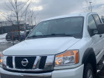 2013 Nissan Titan SV 4WD truck in excellent condition with dual exhaust and tow accessories