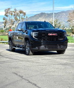 2022 GMC Sierra X31 SLT 4X4 pickup truck with diesel engine in a scenic outdoor setting