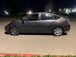 2010 Toyota Prius hybrid car in gray, showcasing side view with clean lines and modern design.