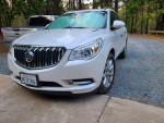 2016 Buick Enclave in white frost tricoat, excellent condition with 60,000 miles and V6 engine.