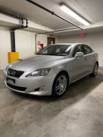2007 Lexus IS 250 RWD parked in garage with sleek design and alloy wheels