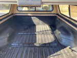 Interior view of the truck bed with 5th wheel rails in a 1996 F-250 in excellent condition.