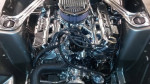 Close-up of a rebuilt Ford Mustang 351W engine with chrome components and performance enhancements.