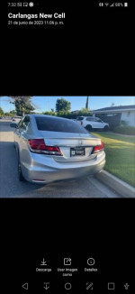 Rear view of a silver 2015 Honda Civic SE with a clean design parked in a residential area.