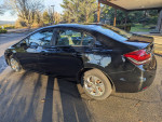 2014 Honda Civic LX in black with 134,000 miles parked outdoors, showcasing sleek design and good condition.