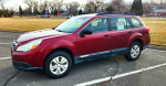 2012 Subaru Outback 2.5i AWD in great condition, parked with 'For Sale' sign, suitable for trips and daily use.