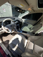 Interior view of a 2011 Volvo XC60 with clean leather seats, dashboard, and modern controls